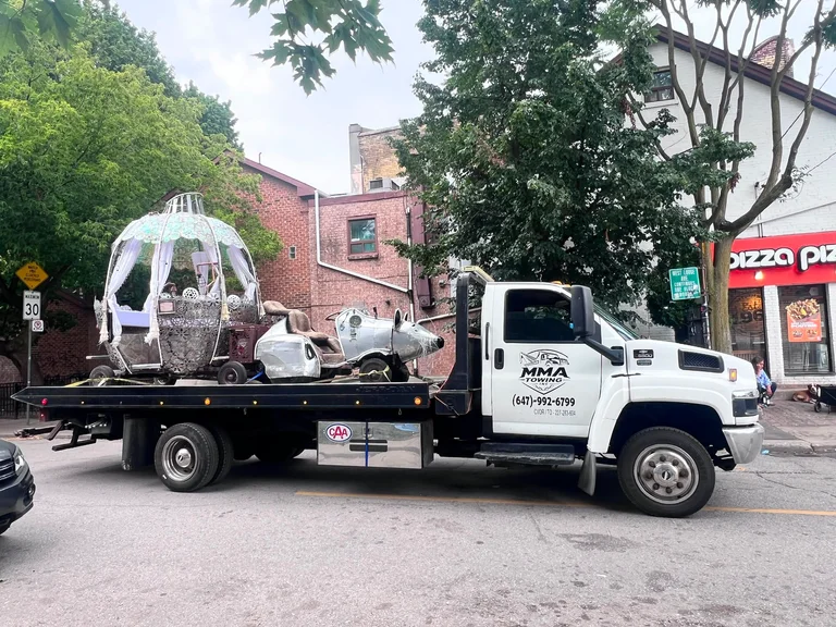 MMA Towing transporting a specialty load on a Toronto street